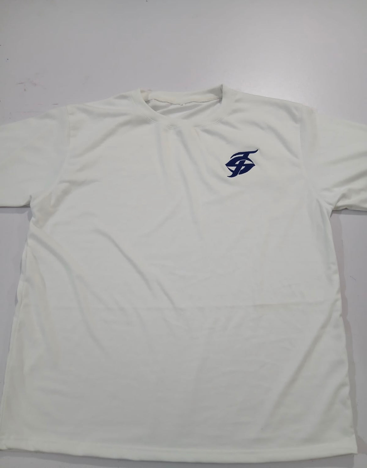 White “The Source” logo tee